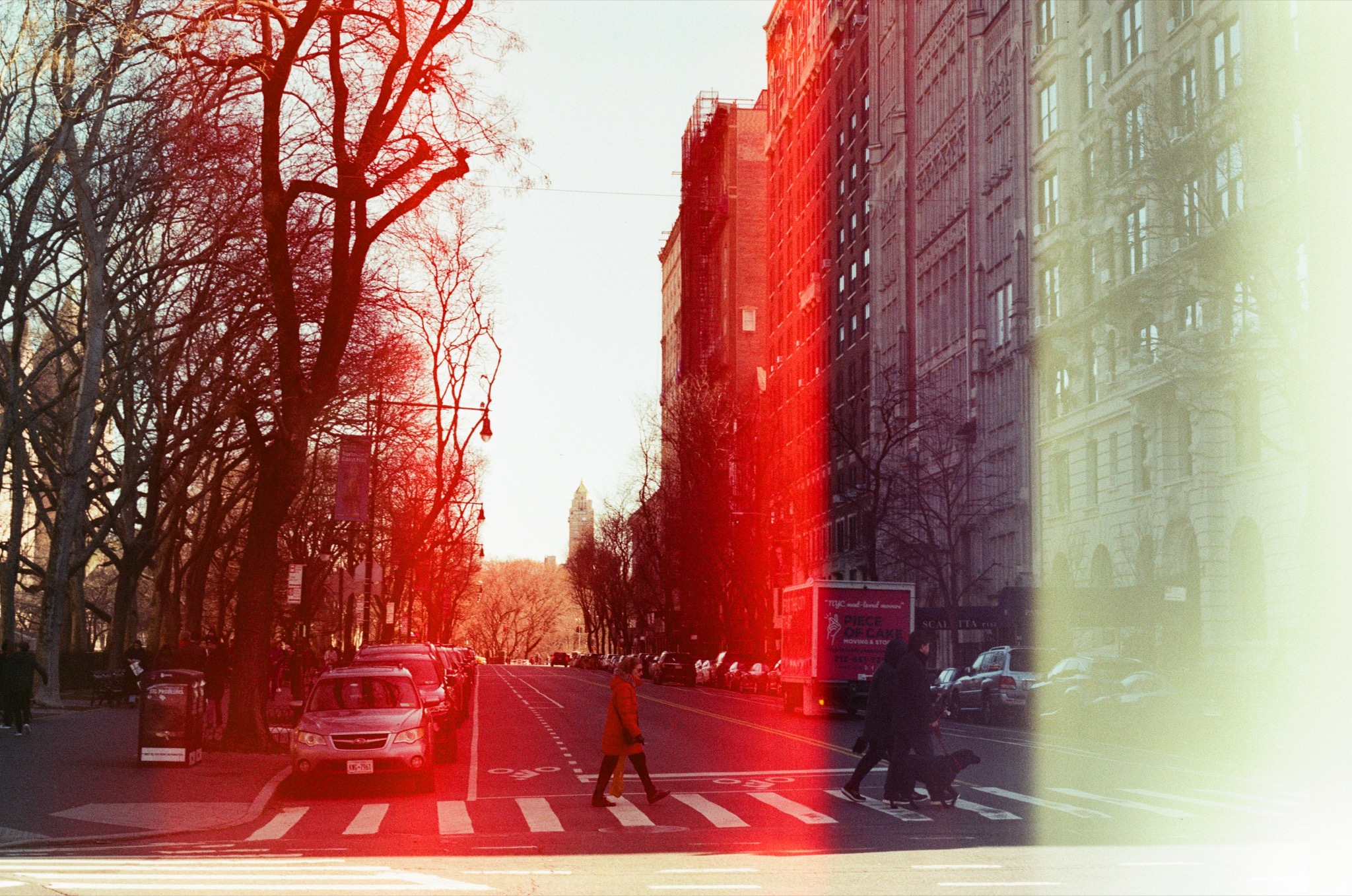 A New York street washed in red and pale green light leaks
